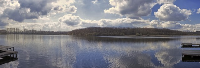 Panorama of a lake (Krickenbecker Seen) with dramatic clouds and calm atmosphere, Nettetal
