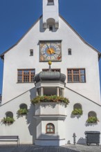 West faÃ§ade with clock and floral decoration, town hall, Kempten, AllgÃ¤u, Bavaria, Germany