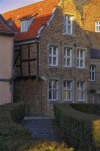 Charming half-timbered house with red tiled roof in the sunlight, DÃ¼sseldorf-Kaiserswerth