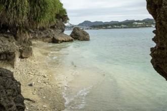 Lover Beach, volcanic rocks and vegetation on the beach of Sesoko-jima, Sesoko Island, Motobu,