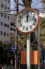 Urban design, close-up, orange Seiko clock, Ikebukuro Living Loop, Public Furniture,