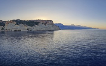 Vibrant seascape sunset with a view to the Pirate Cave in Kemer, Turkey. Beautiful Turkish