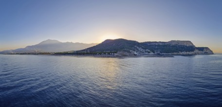 Seaside panoramic view of Kiris resort near Kemer, Turkey, with sunset over the majestic Taurus