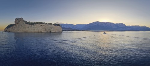 Scenic sunset panorama over Turkish Mediterranean coastline, with majestic Taurus mountains in the