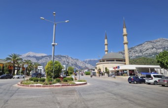 KEMER, TURKEY - JULY 5, 2025 Kemer city centrum view with grand mosque Huzur Camii Dzamija with two