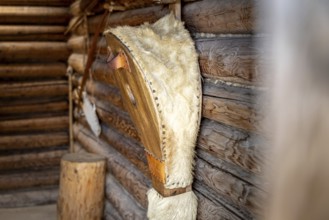 Interior design with fur on wooden walls in a cosy atmosphere, pile dwellings Unteruhldingen