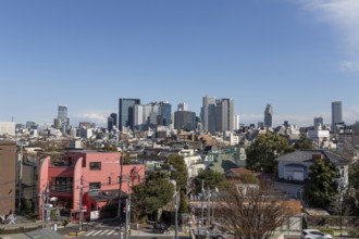 Modern architecture, view over the rooftops of the city to the glass facades of skyscrapers against