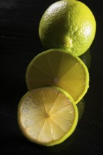 Limes on a black stone slab
