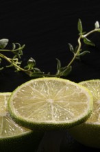 Three lime slices with green decoration