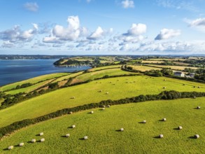 Farms and Fields over St Mawes from drone, Carrick Roads, River Fal, Falmouth, Cornwall, UK