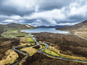 View over Eas a' Bhradain Waterfall from drone, Red Cuillin mountains, Loch Ainort, Isle of Skye,