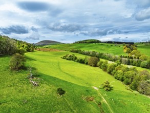 Farms and mountains over Ullswater Lake from drone, Pooley Bridge, Lake District National Park,