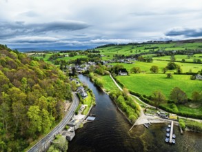 Farms and mountains over Ullswater Lake from drone, Pooley Bridge, Lake District National Park,