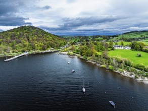 Farms and mountains over Ullswater Lake from drone, Pooley Bridge, Lake District National Park,