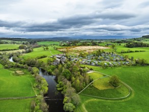 Farms over Ullswater Lake from drone, Pooley Bridge, Lake District National Park, Cumbria, England,