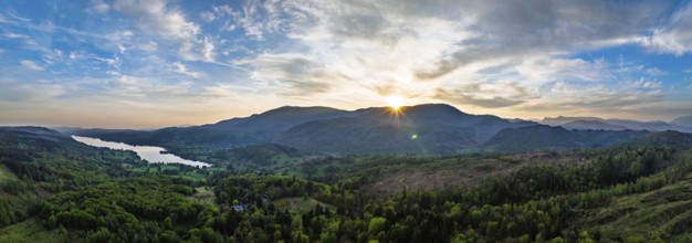 Panorama of Sunset over Mountains and Coniston Water from drone, Lake District National Park,