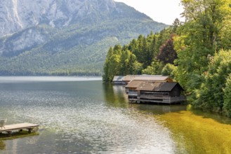 Lake Altaussee with boathouses on the shore, surrounded by wooded mountains, Altaussee, Styria,