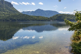 Clear water at Lake Altaussee with mountain landscape under a blue sky, Altaussee, Styria, Austria