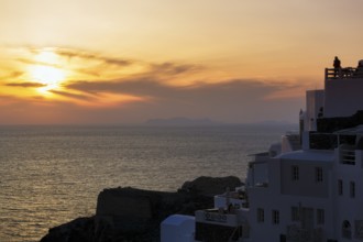 Holiday homes on the edge of the caldera with sea view, sunset, Oia, Thira, Santorini, Cyclades,