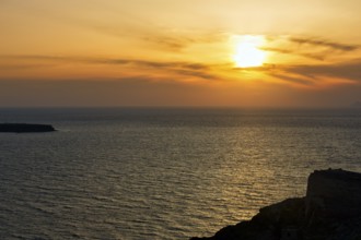 Evening sun behind Cirrus, sunset by the sea, Oia, Thira, Santorini, Cyclades, Greece