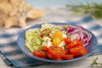 Plate with vegetables and feta in a maritime atmosphere