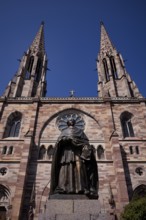 Monument, statue of Charles Emile Freppel, theologian and Bishop of Angers, in front of the church