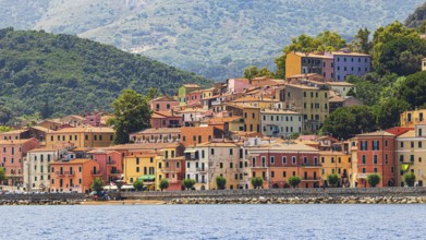 The village of Rio Marina with its pastel-coloured house facades, Elba Island, Tuscan Archipelago
