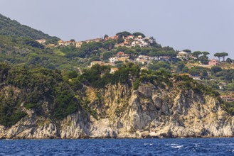 The village of Sant' Andrea above a rocky cliff, Elba Island, Tuscan Archipelago National Park,