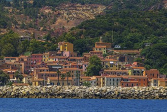 The village of Rio Marina with its pastel-coloured house facades, Elba Island, Tuscan Archipelago
