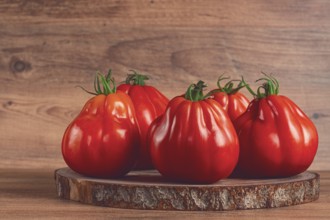 Khinkali tomatoes, on a wooden cutting board, wooden background, no people