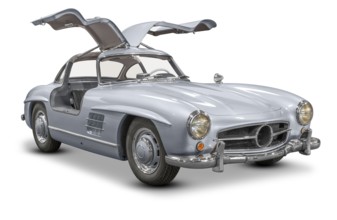 Historic car with opened wing doors isolated in white back with shadow