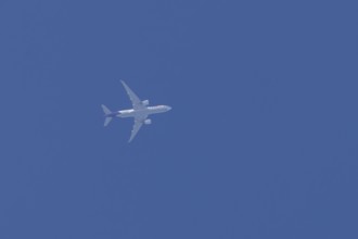 Airbus A300-600RF jet aircraft of FedEx Express airlines in flight in a blue sky, England, United