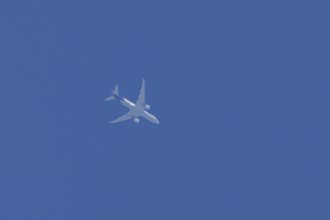 Airbus A300-600RF jet aircraft of FedEx Express airlines in flight in a blue sky, England, United