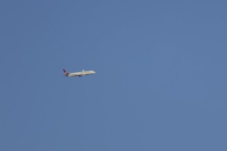 Boeing 787-9 Dreamliner jet passenger aircraft of Virgin Atlantic airlines in flight in a blue sky,