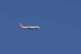 Airbus A320-232 jet passenger aircraft of British Airways airlines in flight in a blue sky, London,