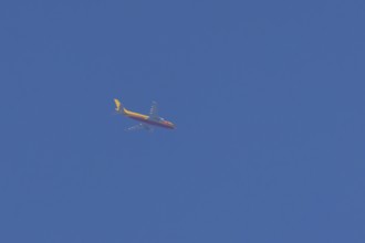 Boeing 767 jet aircraft of DHL cargo airlines in flight in a blue sky, England, United Kingdom