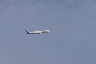 Boeing 777 jet passenger aircraft of Kuwait airlines in flight in a blue sky, England, United