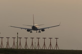 Boeing 737 jet passenger aircraft of Ryanair airlines in flight landing at sunset at London