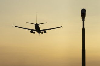 Boeing 737 jet passenger aircraft of Ryanair airlines in flight landing at sunset at London