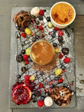Various art desserts with chocolate and fruit on a decorative platter Lower Austria Austria