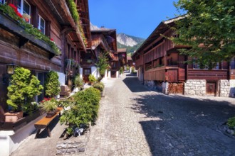 Alley with old wooden houses in Brienz, Canton of Bern, Switzerland