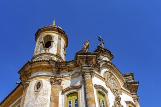 Facade and tower of a historic baroque church in the city of Ouro Preto in Minas Gerais, Ouro