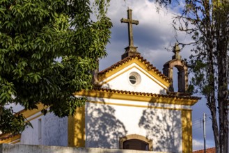 Facade of a church from the early 18th century among the vegetation in the city of Ouro Preto