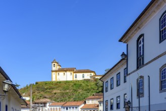 Baroque church on top of the hill among the colonial houses of the city of Ouro Preto, Ouro Preto,
