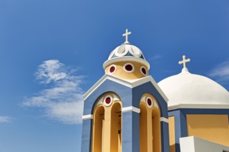 Catholic Church of Saint Stylianos, colourful facade, domes, Fira, Thira, Santorini, Cyclades,