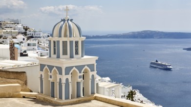 Blue and white bell tower and view of the sea, cruise ship, Firostefani, Thira, Santorini,