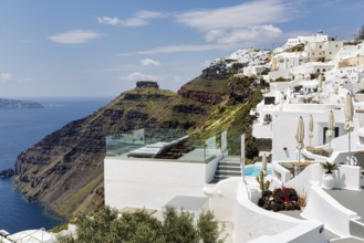 Sun terrace and white holiday homes, cliffs, caldera, Skaros rock formation, Firostefani, Thira,