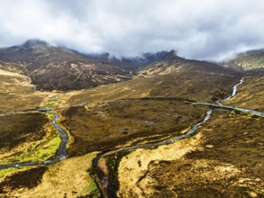 Eas a' Bhradain Waterfall from drone, Red Cuillin mountains, Loch Ainort, Isle of Skye, Scotland,