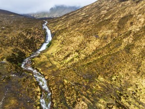 Eas a' Bhradain Waterfall from drone, Red Cuillin mountains, Loch Ainort, Isle of Skye, Scotland,