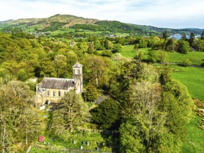 Holy Trinity Church from a drone, Bog Lane, Brathay village, Lake District, Cumbria, England,